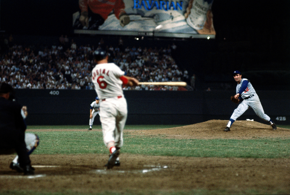 St. Louis Cardinals' Stan Musial scores from second as Boston