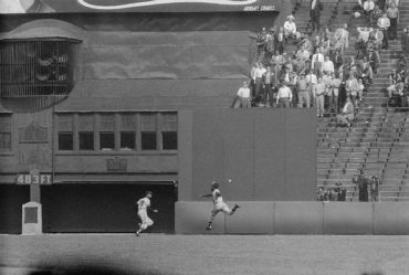 Polo Grounds, Manhattan, NY, May 19, 1956 – Hank Aaron chases down a Willie Mays triple