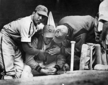 Wrigley Field, Chicago, IL, September 27, 1938 – Cubs Dizzy Dean is comforted after being pulled from crucial pennant race game