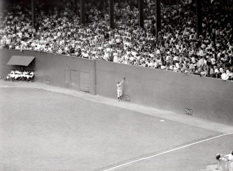 Polo Grounds, Manhattan, NY, June 28, 1951 – Giants Don Mueller snags a hard hit liner by Dodgers Carl Furillo at the top of the right field wall