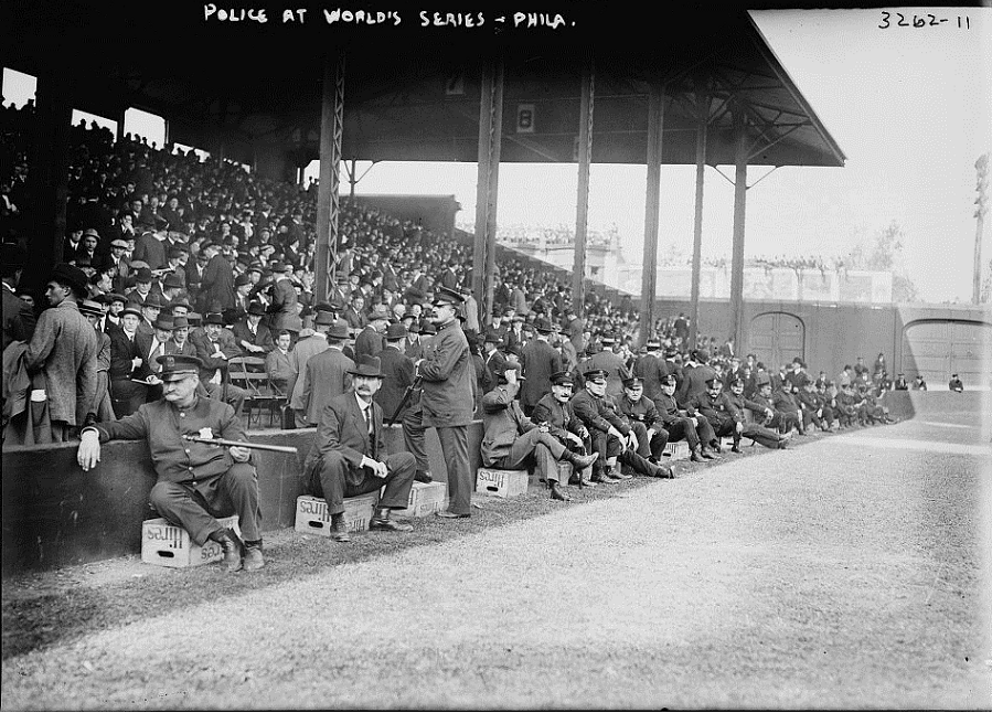Shibe Park, Philadelphia, PA- Philly police seat on Hire’s Root Beer crates during 1914 World Series