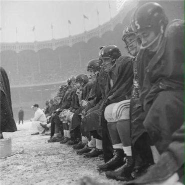 NFL in Ballpark Series, Yankee Stadium, Bronx, NY, December 14, 1958 – Giants try to stay warm during crucial game against the Cleveland Browns