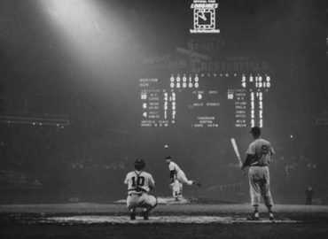 Comiskey Park, Chicago, IL, August 23, 1957 – Red Sox great Ted Williams waits for White Sox southpaw Billy Pierce to get done with 6th-inning warmups