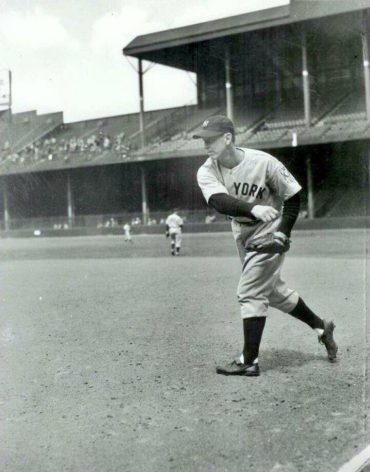 Briggs Stadium, Detroit, MI, May 2, 1939 – Babe Dahlgren warms up at first base as Lou Gehrig consecutive games streak comes to an end
