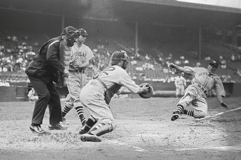 Fenway Park, Boston, MA, August 4, 1937 – Indians Frankie Pytlak  slides under the tag by Red Sox catcher/spy Moe Berg