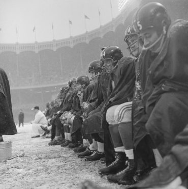 NFL in Ballpark Series: Yankee Stadium, Bronx, NY, December 14, 1958 – Browns and Giants battle each other and the elements for a playoff spot
